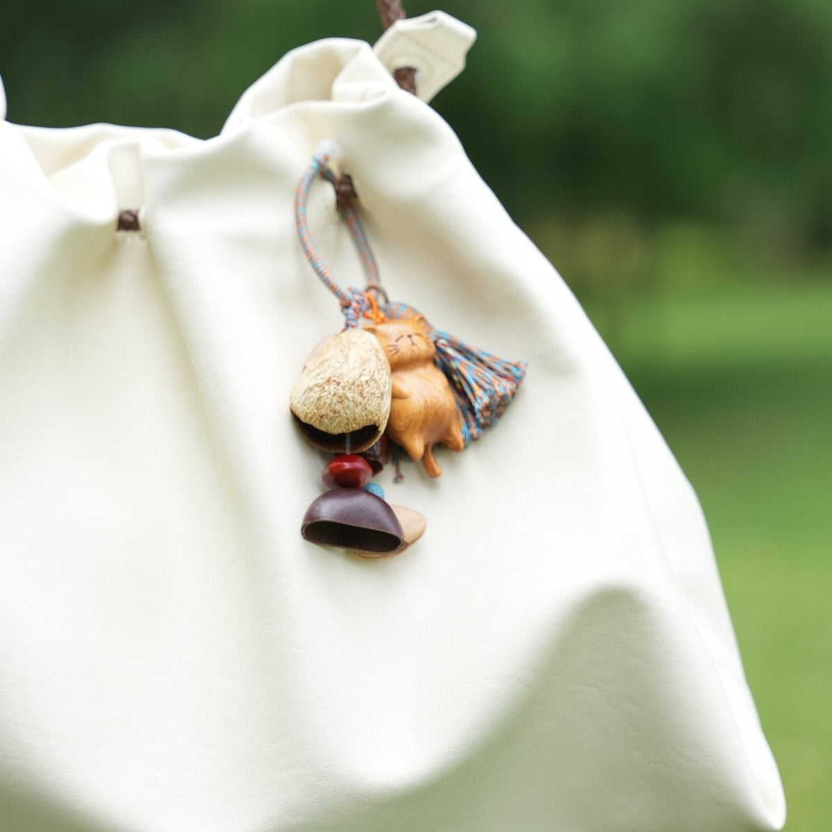 "The Naptime Kitty" - Hand - Carved Wooden Cat Charm with Natural Seeds & Tassel - Yunicrafts