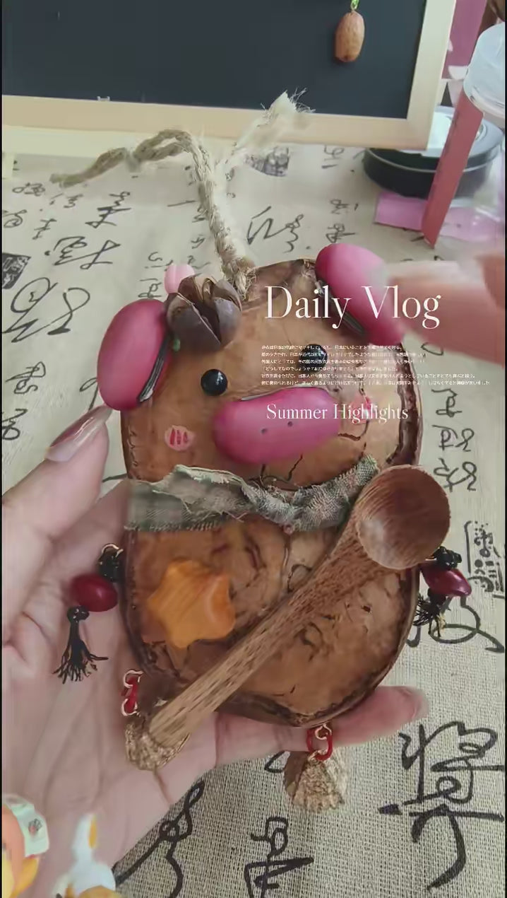 Entada pod bear ornament with spoon and small accessories on a tabletop
