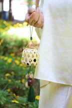 "The Bamboo Lantern" - Hand - Woven Cage Charm with Seed Bells & Emerald Tassel - Yunicrafts
