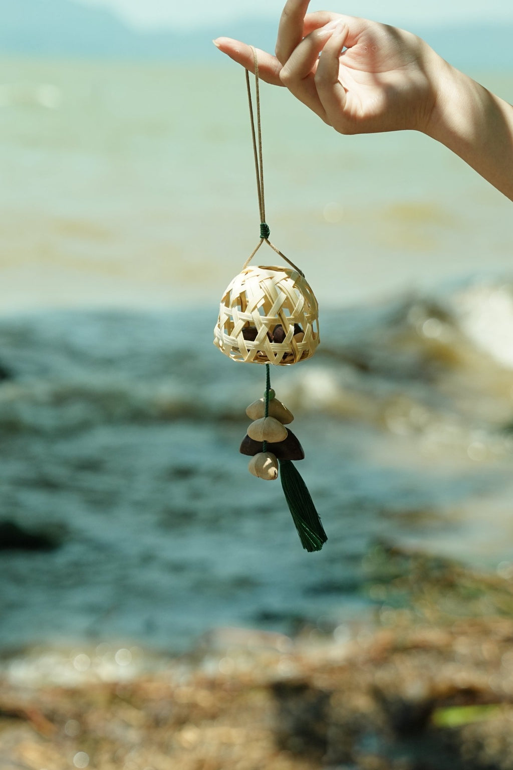 "The Bamboo Lantern" - Hand - Woven Cage Charm with Seed Bells & Emerald Tassel - Yunicrafts