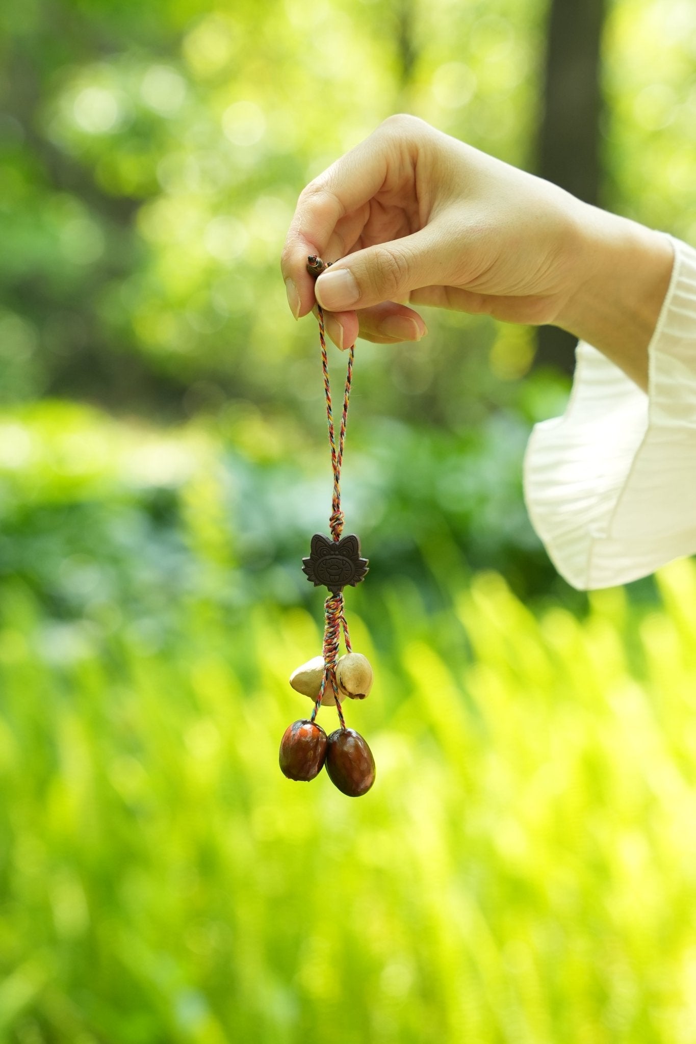 "The Brave Tiger Guardian" - Folk Art Tiger Head Charm with Colorful Cord & Seeds - Yunicrafts