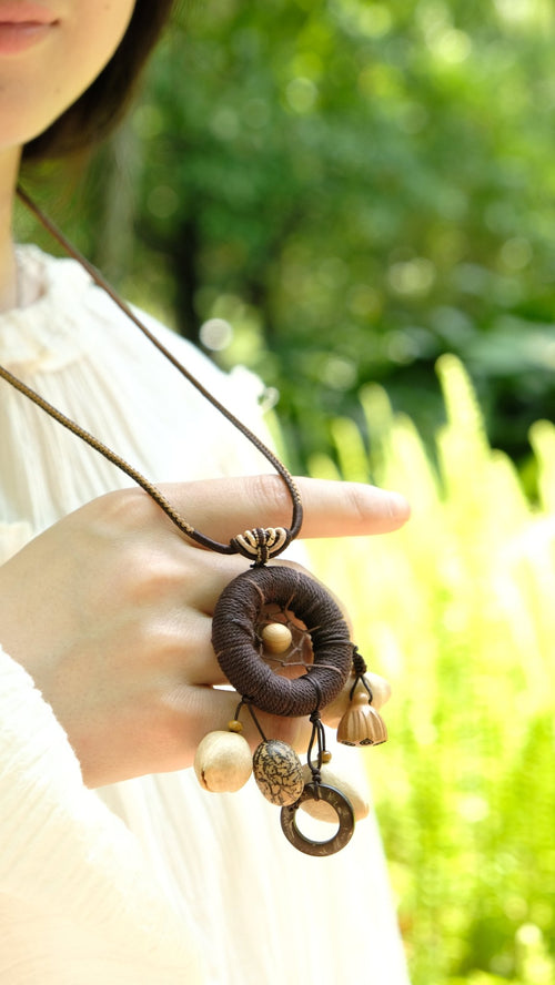 "The Dream Weaver" - Hand - Woven Dreamcatcher Necklace with Natural Seeds - Yunicrafts