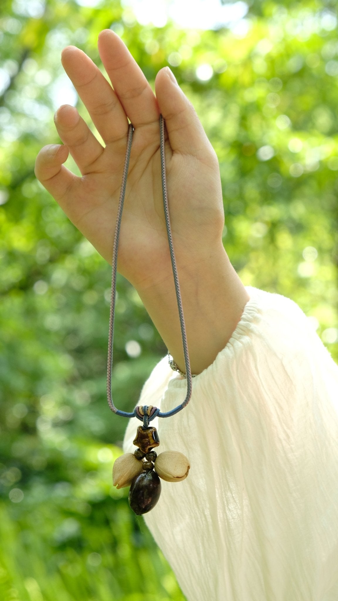 "The Guiding Star" - Natural Seed Pendant Necklace with Glazed Star Bead - Yunicrafts