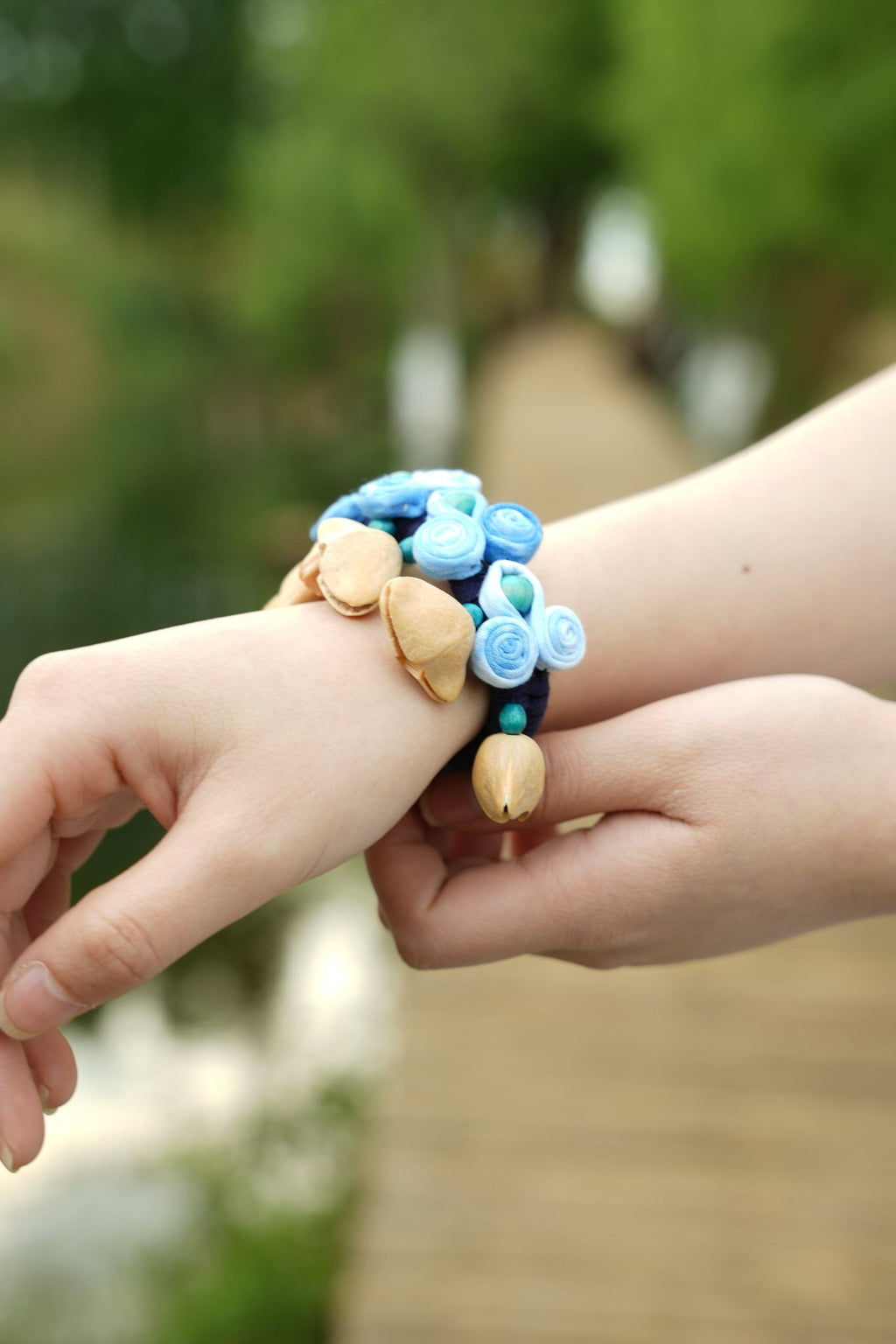 "The Indigo Ripple" - Handcrafted Blue Fabric Rosette Wrist Rattle with Seed Bells - Yunicrafts