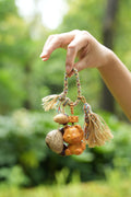 "The Little Bear Guardian" - Hand - Carved Wood Bag Charm with Natural Nut & Tassel - Yunicrafts