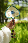 "The Lucky Breeze" - Hand - Woven Heart Palm Fan with Blue Elephant & Seed Charm - Yunicrafts