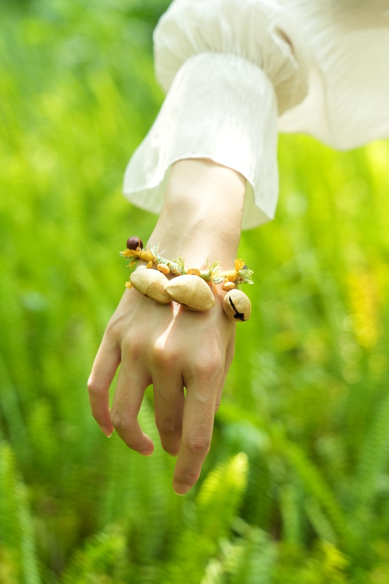 "The Meadow Dancer" - Yellow & Green Braided Bracelet with Natural Seed Bells - Yunicrafts