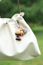 "The Naptime Kitty" - Hand - Carved Wooden Cat Charm with Natural Seeds & Tassel - Yunicrafts