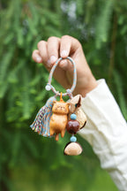 "The Naptime Kitty" - Hand - Carved Wooden Cat Charm with Natural Seeds & Tassel - Yunicrafts