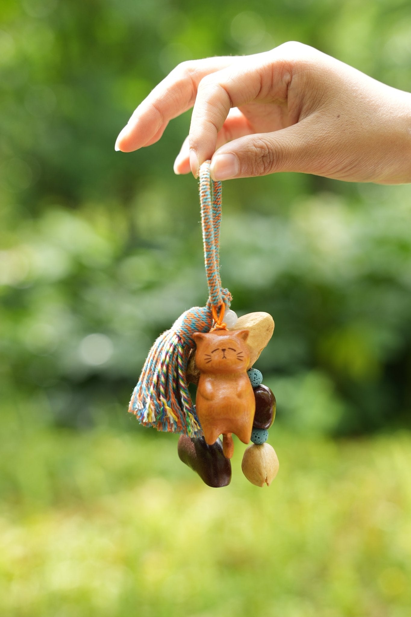 "The Naptime Kitty" - Hand - Carved Wooden Cat Charm with Natural Seeds & Tassel - Yunicrafts