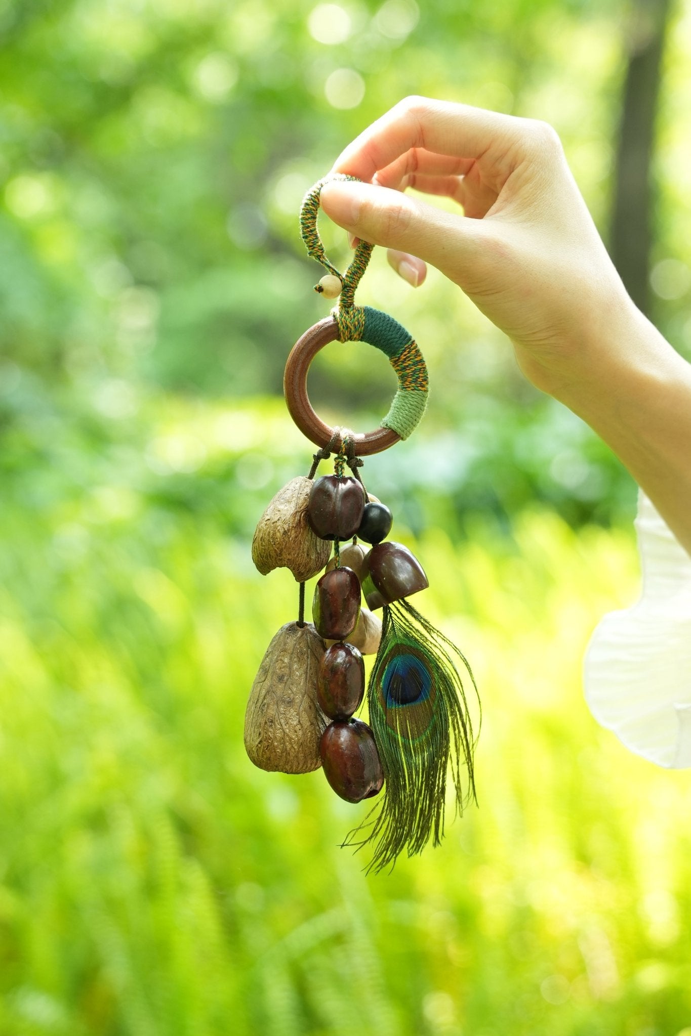 "The Peacock Spirit" - Yarn - Wrapped Wood Ring Charm with Real Peacock Feather & Seeds - Yunicrafts