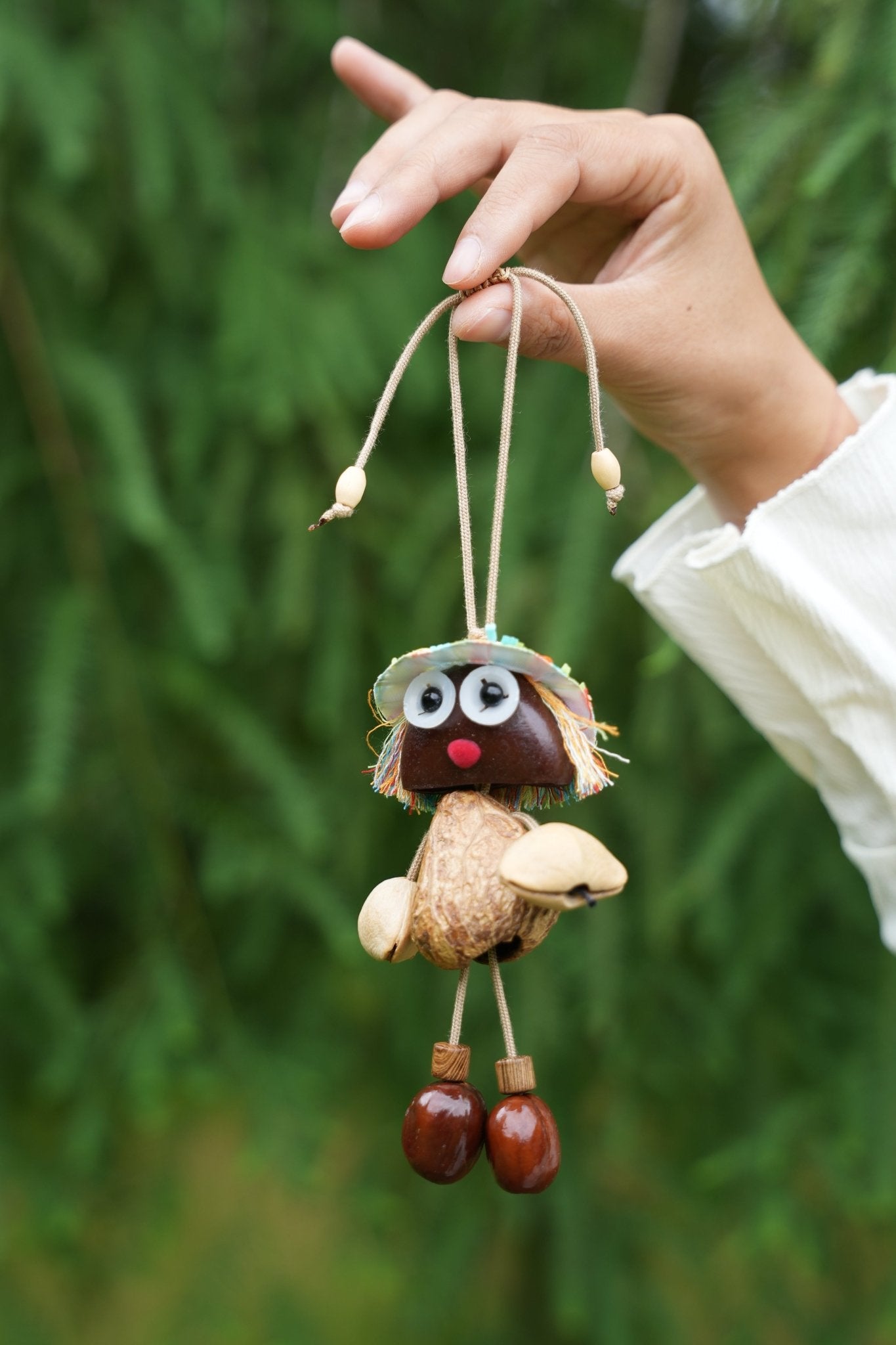 "The Seed Sprite" - Handcrafted Nut Shell Doll Charm with Colorful Fringe Hair - Yunicrafts