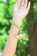 "The Spring Whisper" - Pastel Hand - Woven Bracelet with Nut Shell Bells - Yunicrafts
