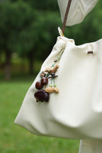 "The Woodland Whisper" - Sage Green Macrame & Natural Seed Bag Charm - Yunicrafts